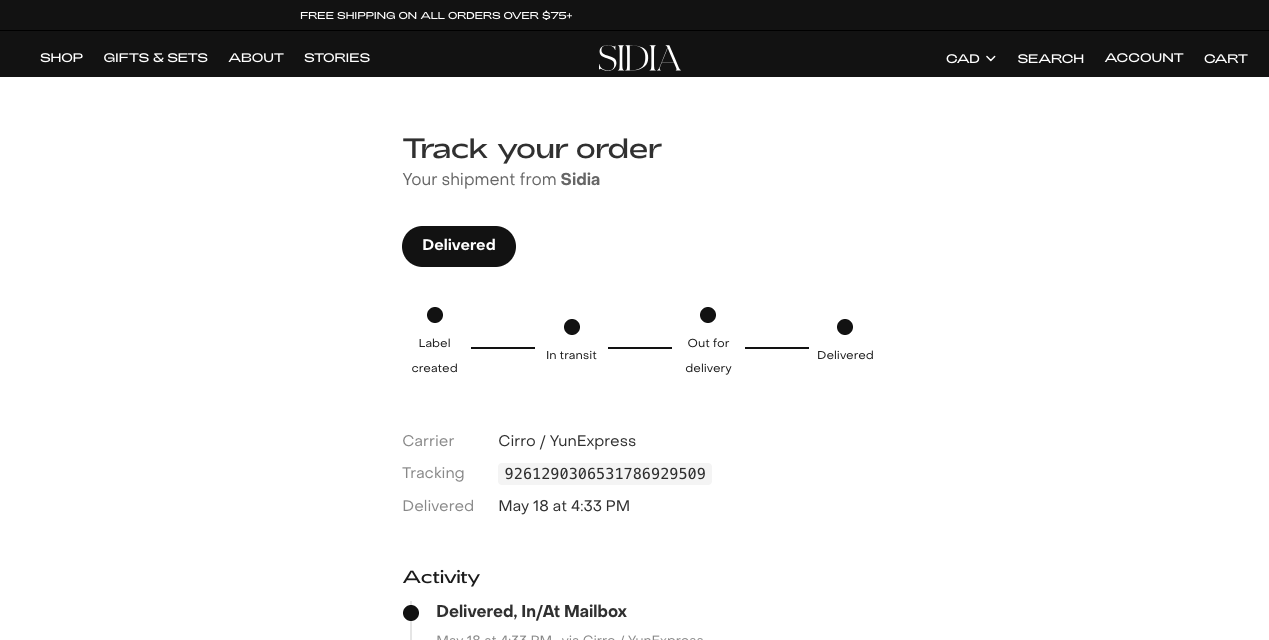 Sidia's live branded tracking page, delivered state with full carrier status and activity feed